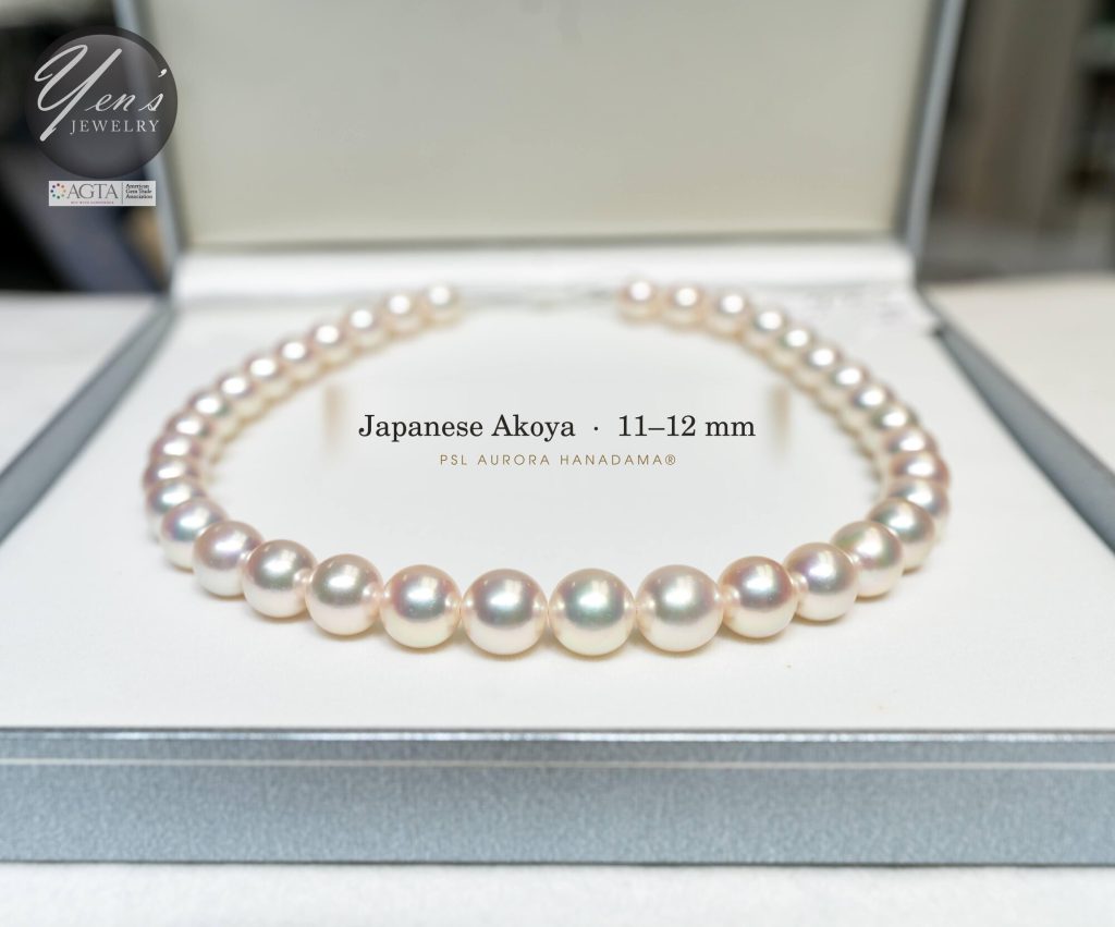 11 to 12 mm Hanadama Akoya strand in its box, front view