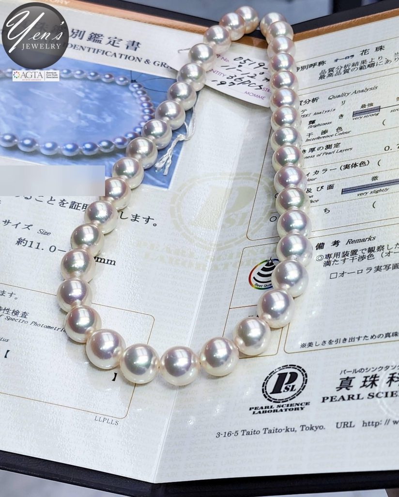 Close view of the Hanadama strand on its PSL report showing the Aurora Hanadama designation, report number blurred