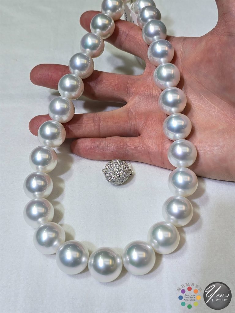 The South Sea strand in hand with its pave diamond ball clasp