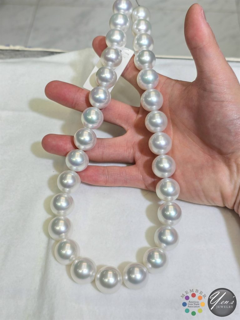 The 29-pearl South Sea strand held in a hand, showing the size of the 17 to 18.7 mm pearls